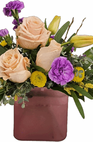 This beautiful floral arrangement is perfect for a spring day! Featuring Tulips and Roses and other spring flowers arranged sweetly in a colorful cube.  