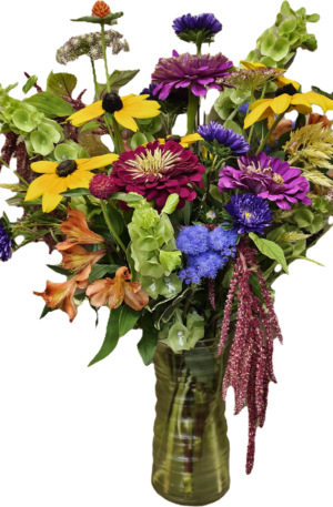 Photo of mixed flowers in a vase.